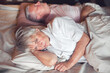 © Tatyana Gladskih - Sad seniors couple in bed at home