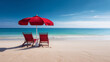 © Keitma - Two red beach chairs and an umbrella on a beautiful white sand beach in front of the ocean on sunny day