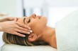 © standret - Woman face getting facial care by beautician hands at spa salon
