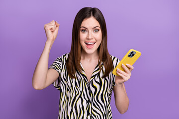 Poster - Photo of young girl fun fist up hold phone wear zebra retro print shirt hold phone victory bet profit isolated on violet color background