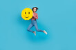 © deagreez - Full length photo of charming pretty woman dressed print top jumping high rising smiley pinata empty space isolated blue color background