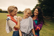 © Jacob Lund - Three women enjoying a playful day outdoors in the park