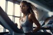The strength and agility of a female athlete as she engages in high - intensity interval training( HIIT) at the gym. Generative AI
