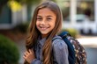 © DesignVectX - Portrait of a caucasian student girl ready for the first day of school wearing a backpack and posing with a big smile. Generative AI