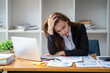 © Wuttichaik - Tired exhausted  fatigue angry business woman manager bookkeeping law firm accounting bored sleepy sitting at desk, business woman stressed about meeting online project document on laptop computer