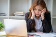 © Wuttichaik - Tired exhausted  fatigue angry business woman manager bookkeeping law firm accounting bored sleepy sitting at desk, business woman stressed about meeting online project document on laptop computer
