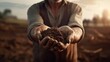 Farmer holding soil in hands close-up. Male hands touching soil on the field. Farmer is checking soil quality before sowing wheat. Agriculture, gardening or ecology concept, Generative AI.