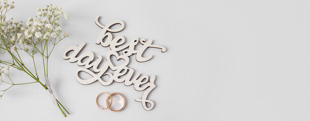 Wall Mural - Composition with wedding rings on light background with space for text