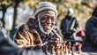 Czarnoskóry uśmiechnięty dziadek gra w szachy w parku z kolegami