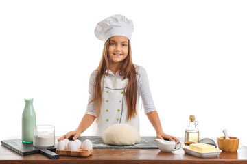 Canvas Print - Little baker at table with dough on white background