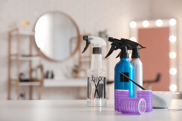 Wall Mural - Different hairdressing tools on table in beauty salon