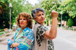 Mature women showing strength and security posing in a park