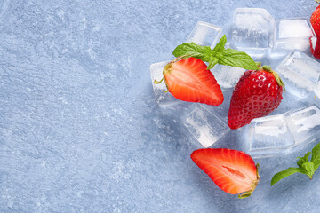 Sticker - Fresh strawberry with ice cubes on blue background