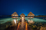 Fototapeta Miasta - Tropical Resort in the Lagoon by night