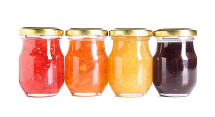 Wall Mural - Jars of different jams on white background