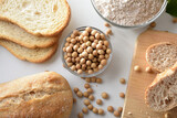 Fototapeta Kuchnia - Detail of bread with soy flour and beans top view