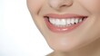 © SayLi - a close up photo of the lower part of a female face. beautiful cute smile with very clean perfect teeth. chin, nose and mouth visible. dental service advertisement. white background. Generative AI