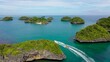 People ride the inflatable watercraft raft. Sea attraction, aerial view. Hundred Islands national Park, Pangasinan, Philippines. Summer and travel vacation concept. Water sports and recreation on a