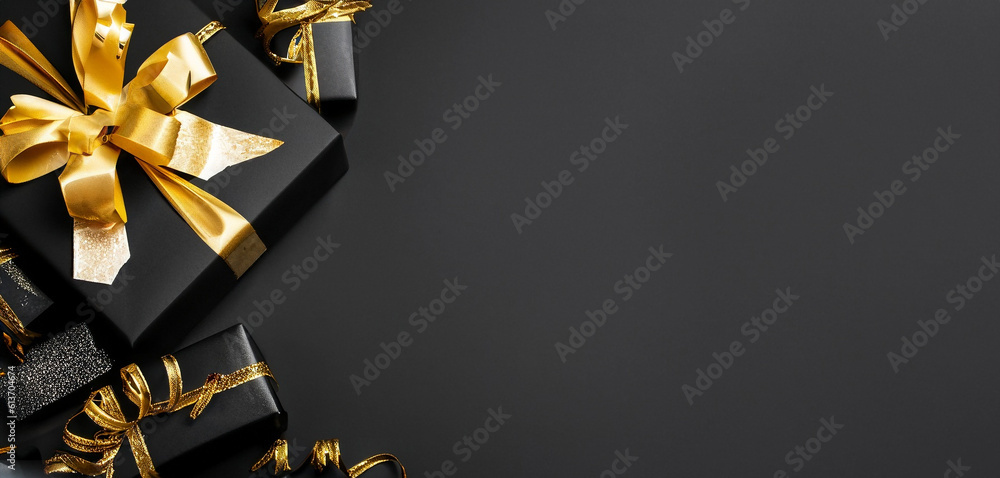 Black gifts with gold ribbons. Christmas gift boxes on black background ...