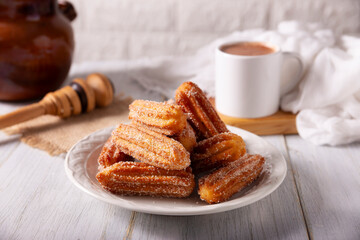 Churros. Fried wheat flour dough, a very popular sweet snack in Spain, Mexico and other countries where it is customary to eat them for breakfast or snack accompanied by hot chocolate or coffee.