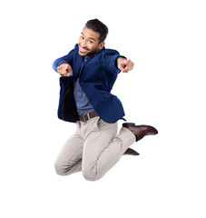 Portrait, pointing and a business man jumping isolated on transparent background in celebration of achievement. Success, motivation or energy with an excited male employee in a corporate suit on PNG