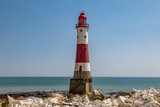 Fototapeta  - Beachy Head Lighthouse Viewed at Low Tide, on a Sunny Summer's Day