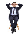 © Harsh Shrikant/peopleimages.com - Portrait, relax and a business man sitting on a chair in a suit isolated on a transparent background. Corporate, smile and professional with a happy male employee finished with a work task on PNG