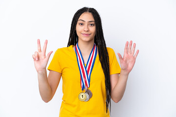 Poster - Teenager girl with braids and medals over isolated pink background counting eight with fingers