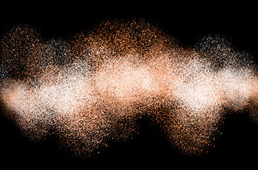 Flour bursting spilling on black background. Toned orange. makeup brush with falling red powder. Makeup brushes in burst of beige powder on dark background.