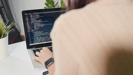Programmer woman writing program HTML code sitting at workplace in office, IT software developer hands typing data coding programming with laptop computer, IT start up concept, Web application design