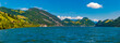Huge panorama picture of the Alpnachersee, a side arm of Lake Lucerne (Vierwaldstättersee) all the way to Stansstad on a sunny day with a blue sky. The beautiful view is from the pier of Alpnachstad.