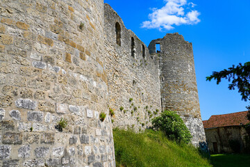 Wall Mural - Low-angle view of the walls of the medieval castle of Yèvre le Châtel and its four round corner towers in the department of Loiret, France