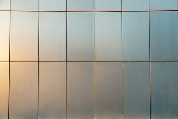 facade wall metal tiles of contemporary building. construction archetecture texture