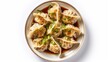 Traditional japaneese gyoza dumplings with  chopped green onions and sesame seeds in ceramic plate on wooden table. Top view. AI generated