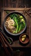Asian Noodle soup with pak choi, vegetables and sesame seeds on wooden tray. Top view. AI generated