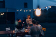 © Carlo Prearo - friends celebrate birthday at a summer backyard dinner