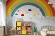 © Pixelite - Mur de chambre d'enfant avec un grand arc-en-ciel. Photo générée par IA