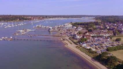 Wall Mural - Sailing boats moored on pontoons next to Warsash on The River Hamble in Hampshire England, aerial video.