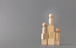 © Alyh M - Wooden Human standing on podium with ranking for winner business and sport competition concept, on grey background.