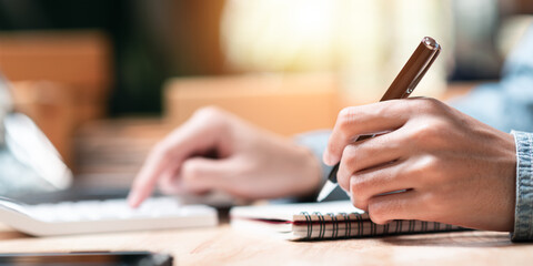 Aufkleber - business owner using a calculator to calculate numbers ,profit and loss statement review of company performance ,effective tax deduction planning for individuals and companies paying tax rates