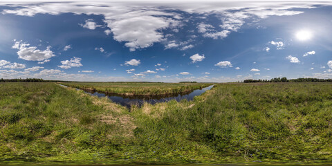 Wall Mural - spherical 360 hdri panorama among green grass farming field near melioration reclamation canal in equirectangular seamless projection, as sky dome replacement, game development as skybox or VR content