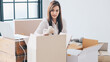 © themorningglory - Entrepreneur woman use laptop contact with customer and package product prepare shipping