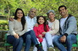 © Maahir - Happy Indian family with grandparents enjoying in the greenery