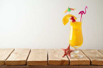 Summer fresh cocktail on wooden board over white wall background. Holidays vacation concept