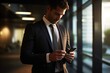 © DesignVectX - A close - up shot of a businessman using a smartphone in a modern office environment. Generative AI