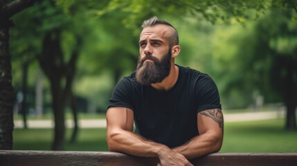 Canvas Print - A man with a beard sitting on a bench. Generative AI image.