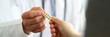 © H_Ko - Closeup of doctor hand giving medical pills to patient. Prescribing medications to patient in illness concept