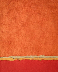 abstract landscape in red and orange - collection of Huun papers handmade in Mexico, vertical background