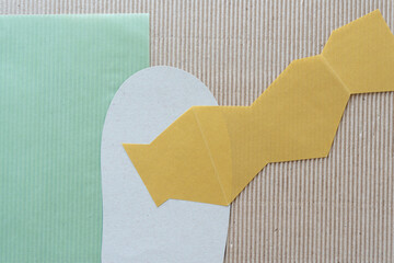 Canvas Print - green, cardboard, and yellow paper shapes on corrugated paper