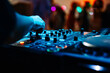 © pavel siamionov - DJ Hands creating and regulating music on dj console mixer in concert